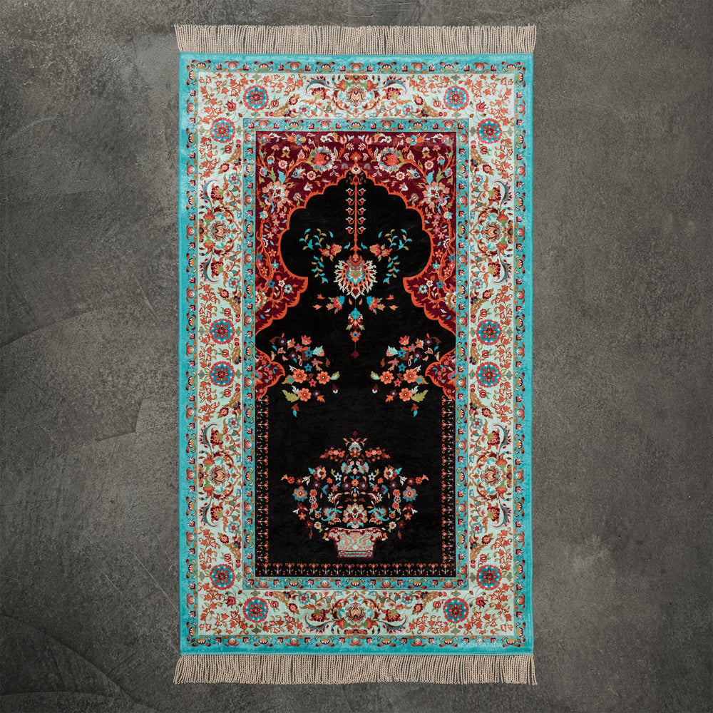 Aesthetic prayer mat in black with a vase of flowers under a mihrab arch, full view