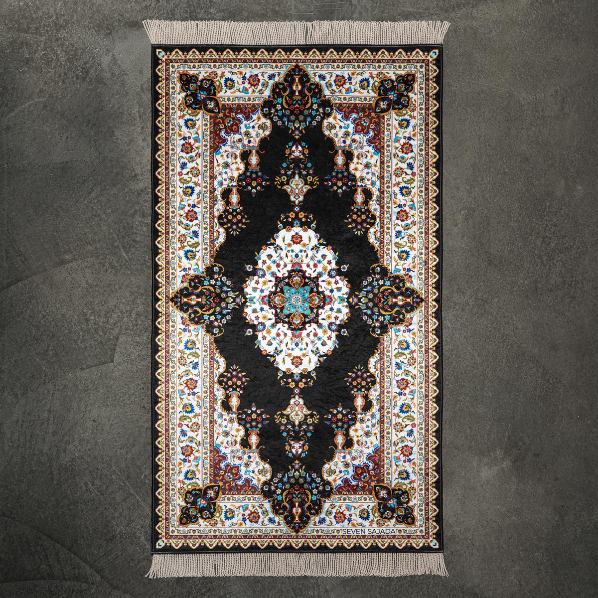 Blossom prayer mat in black with a floral medallion and a cream floral border, full view #color_black