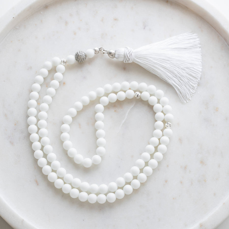 White Quartz tasbih (misbaha) with 99 natural white quartz beads, silver separators and a white tassel on white marble